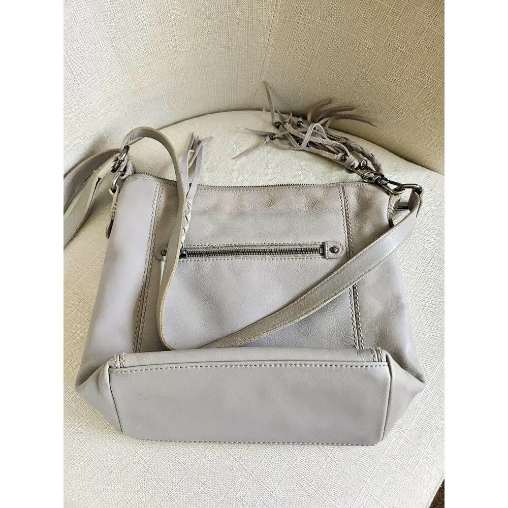 The Sak Stone Gray Leather Crossbody, adjustable, tassel detail